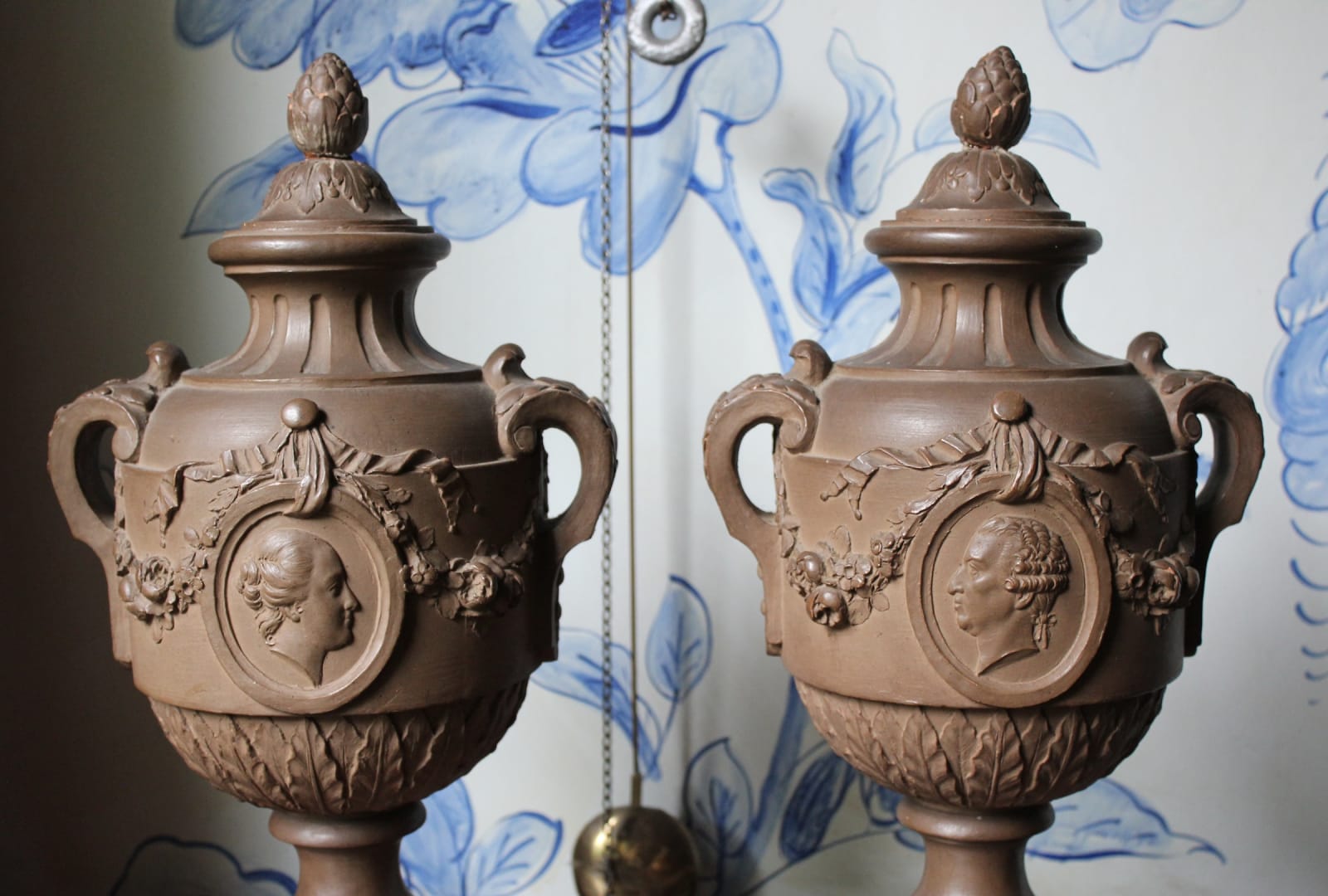 Pair of French terracotta portrait urns, 19th century