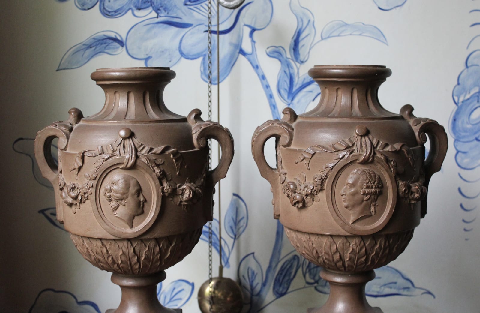 Pair of French terracotta portrait urns, 19th century