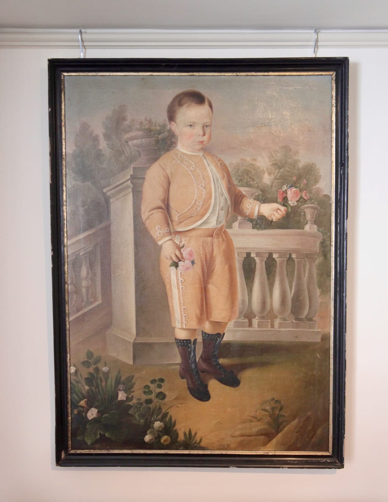 Early 19th century painting of a Nobel boy holding flowers