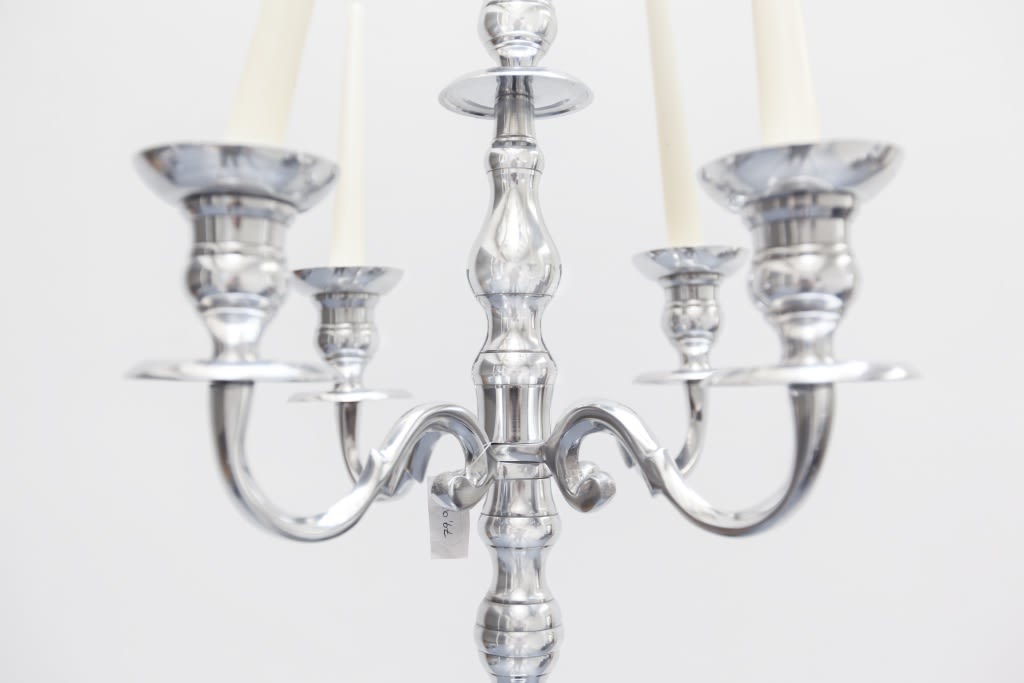 Hans-Peter Feldmann, Candles holder with crossed candles