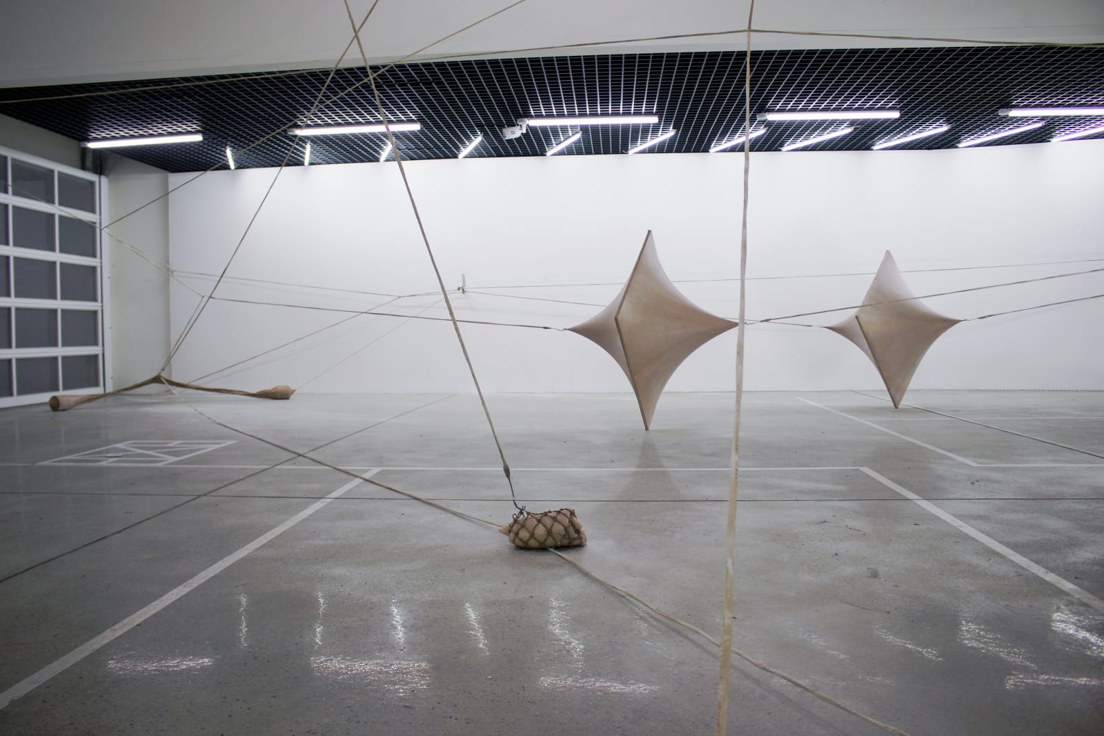 A Single Leg of Moderate Speed, 2015, 5 sculptures that connected to each other, 1 performance video for documenting sculpture: aluminum frame, fabric, latex, silicone, cotton, aqua resin, glass funnels, metal, hulahoop