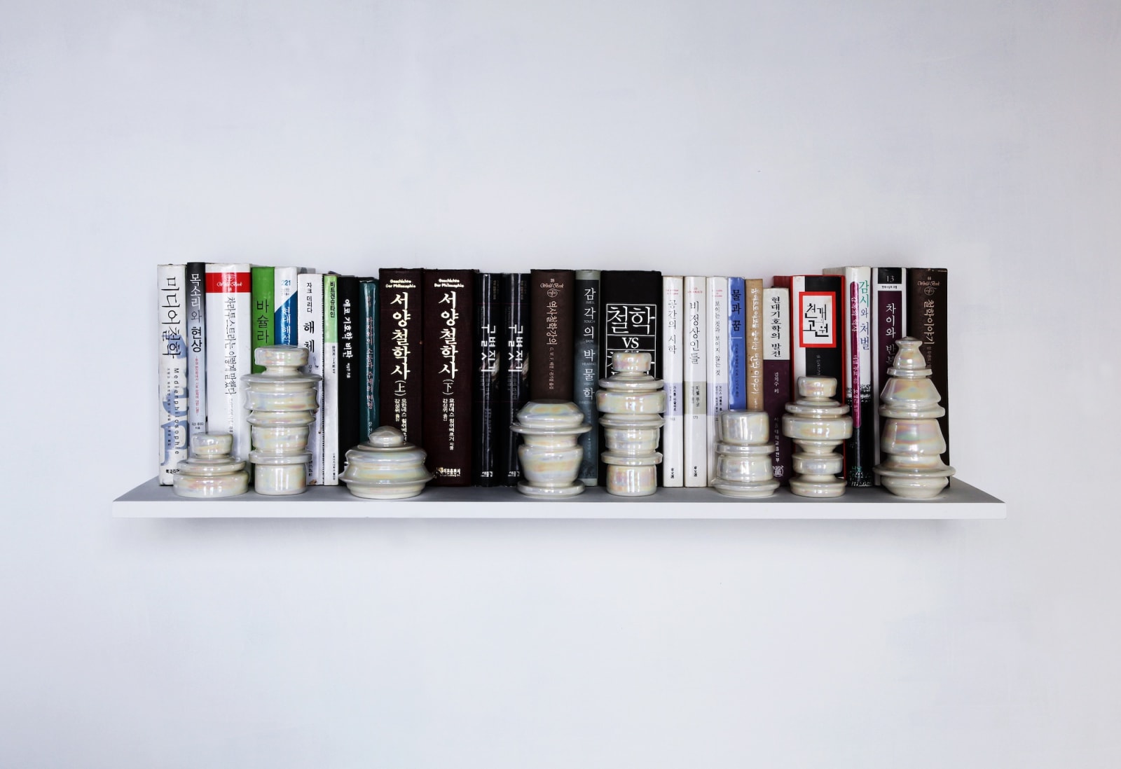Cupboard 2024-#2, 2024, ceramics, hard wood, books, dimension variable