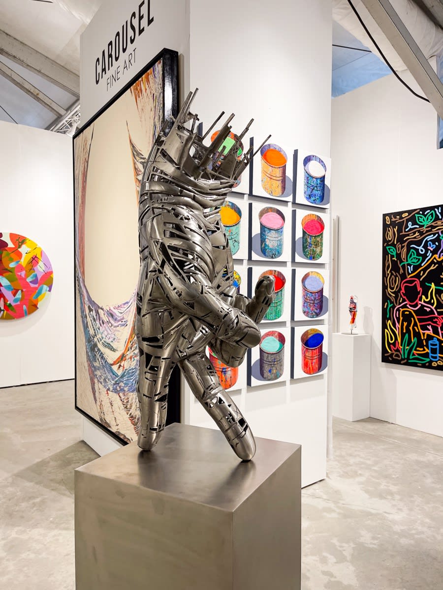 Paintings and sculptures displayed at Carousel Fine Art's booth at the art fair, Context Art Miami 2021.