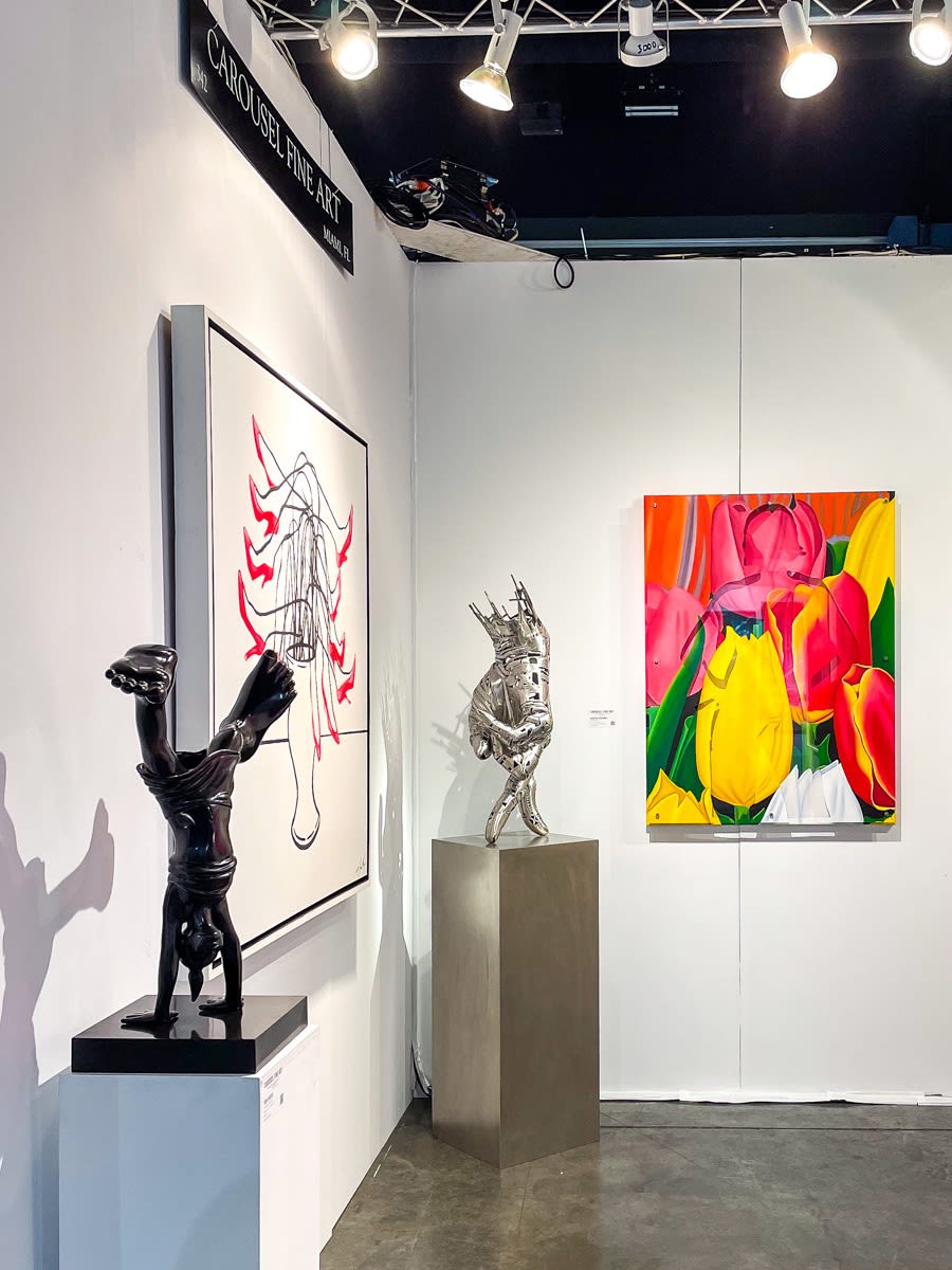 Paintings and sculpture displayed at Carousel Fine Art's booth at the Palm Beach Show art fair, 2022.