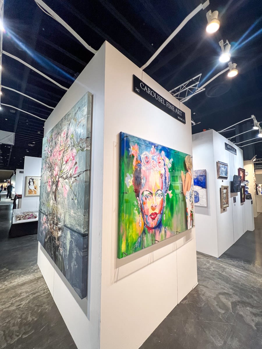 Paintings displayed at Carousel Fine Art's booth at the Palm Beach Show art fair, 2023.