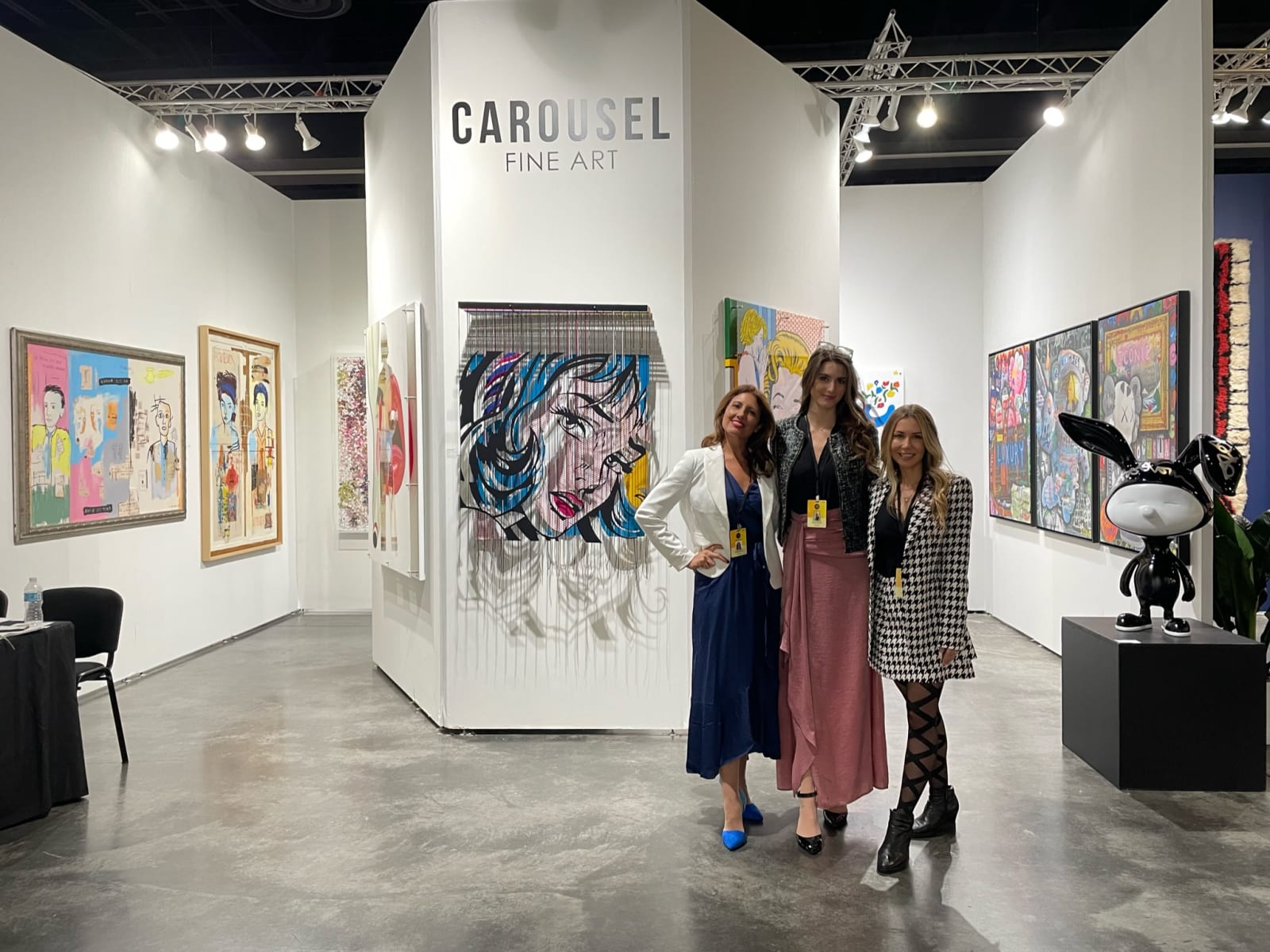 People at Carousel Fine Art's booth at Art Palm Beach, art fair 2023.