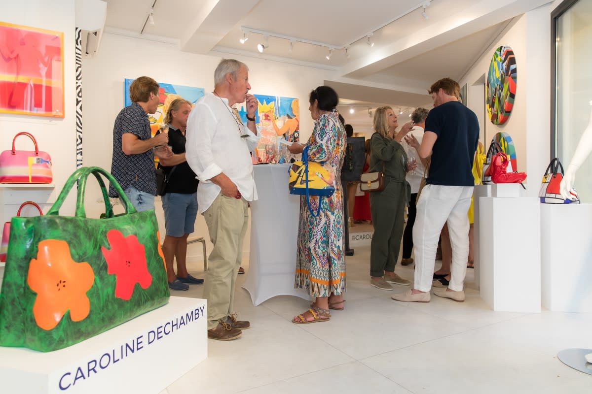 People inside of Carousel Fine Art's gallery space in Saint Tropez.