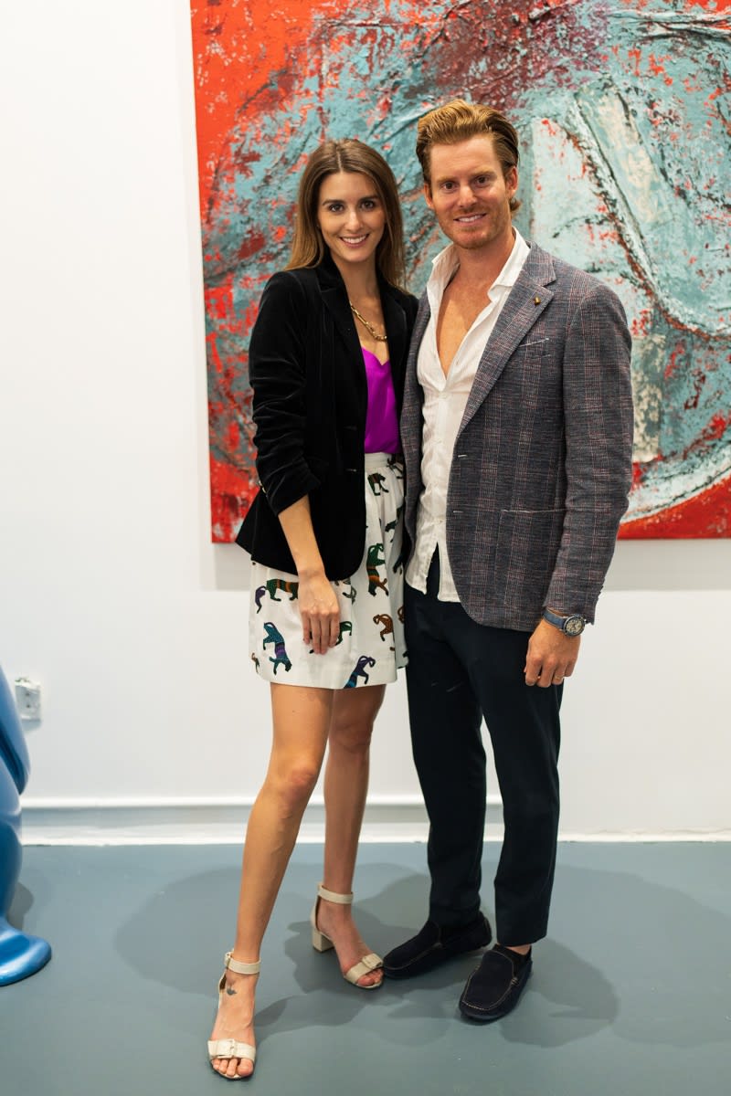 Gallery owners of Carousel Fine Art posing in Carousel Fine Art's Miami gallery space during the Grand Opening.
