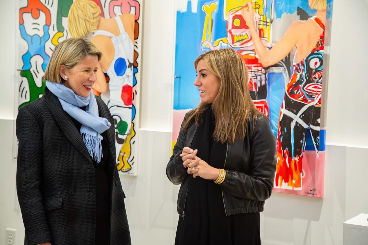 People at Carousel Fine Art's new gallery space in Buckhead Village, Atlanta during an event for their grand opening.