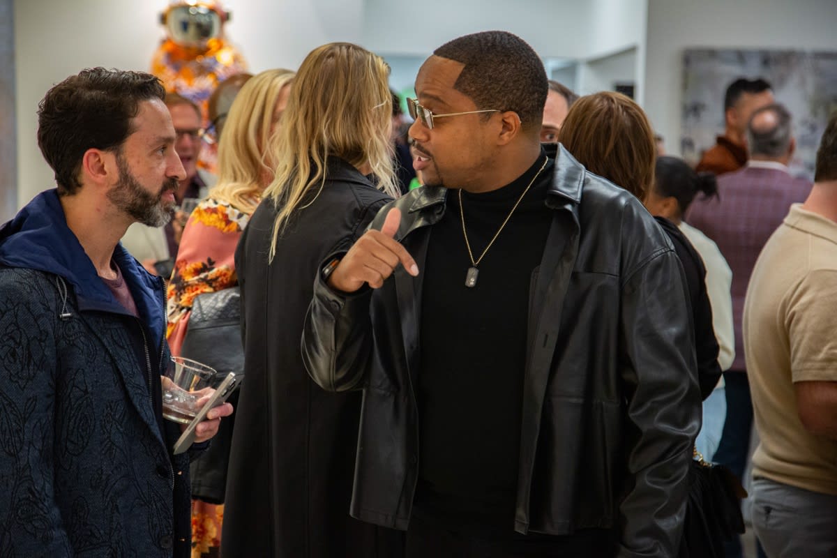 People at Carousel Fine Art's new gallery space in Buckhead Village, Atlanta during an event for their grand opening.