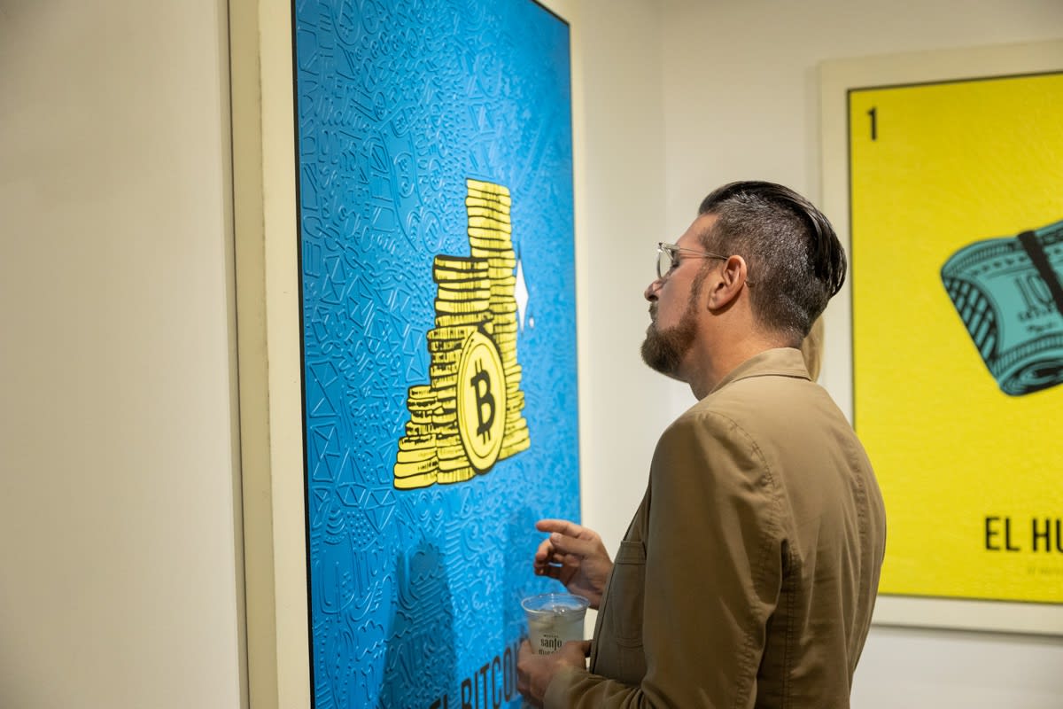 Man staring at painting by Cayla Birk in Carousel Fine Art's Miami location for the Cayla Birk exhibition, "It's in the Cards."