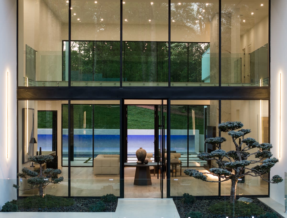 Exterior of a luxury modern home in Atlanta, GA looking into the interior.