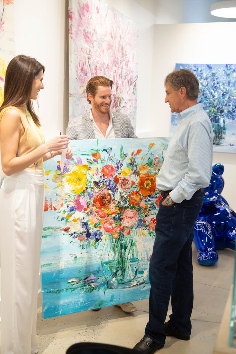 People in Carousel Fine Art's Buckhead Village location during the Eric Alfaro exhibition "Spring Reverie."