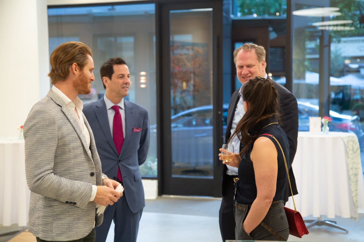People in Carousel Fine Art's Buckhead Village location during the Eric Alfaro exhibition "Spring Reverie."