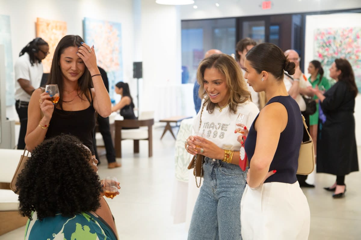 People in Carousel Fine Art's Buckhead Village location during the Eric Alfaro exhibition "Spring Reverie."