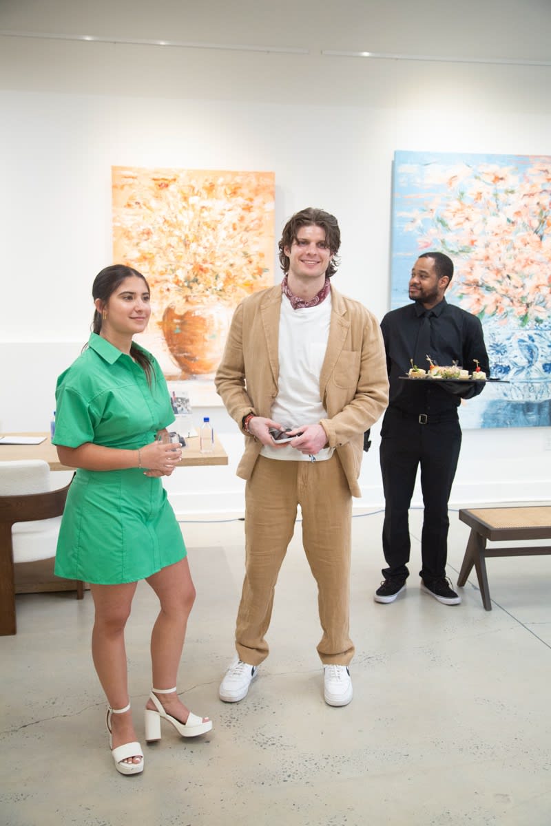 People inside Carousel Fine Art's Buckhead Village location during the Eric Alfaro exhibition "Spring Reverie."