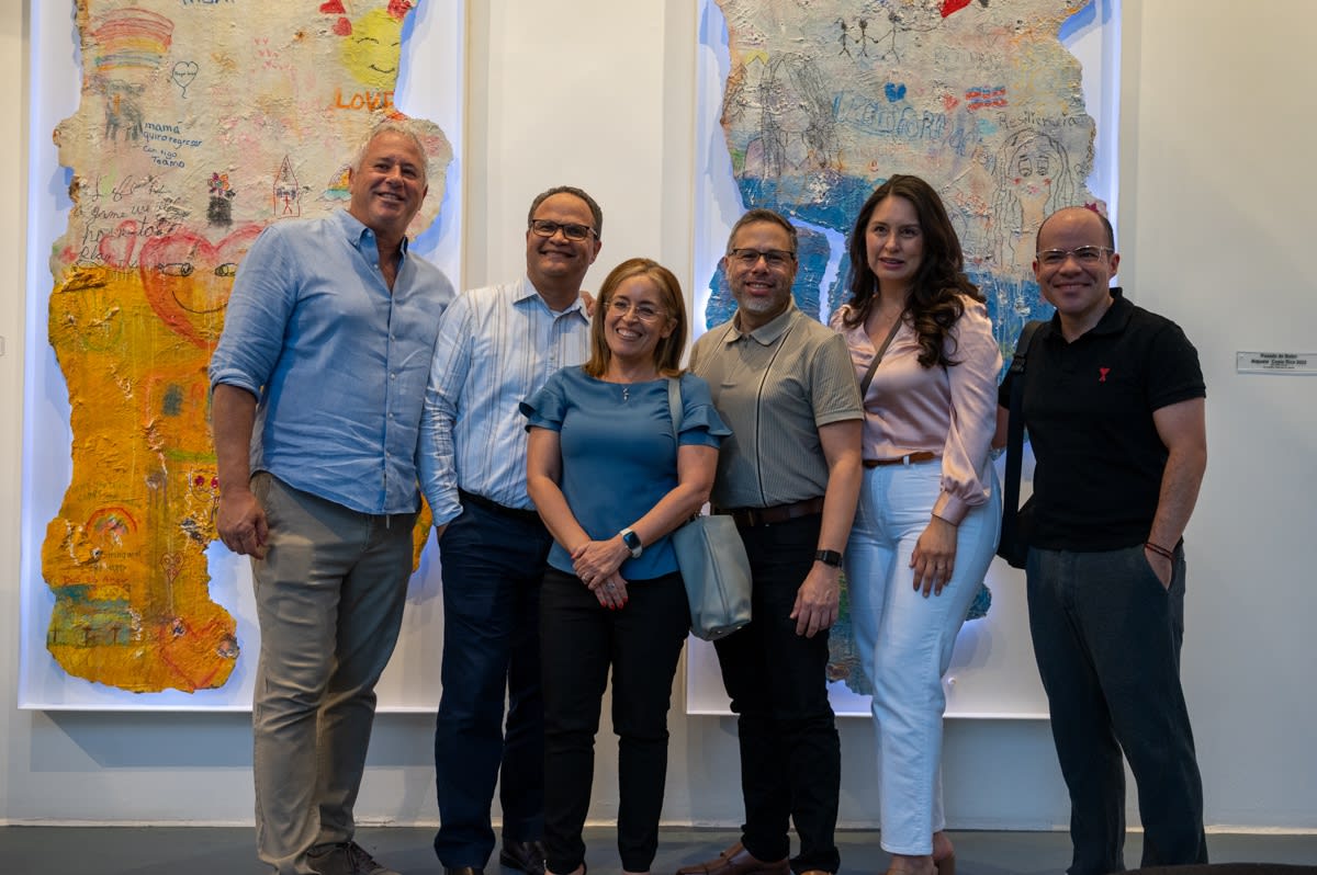 People at Carousel Fine Art's Miami gallery space for the exhibition, "If These Walls Could Talk."