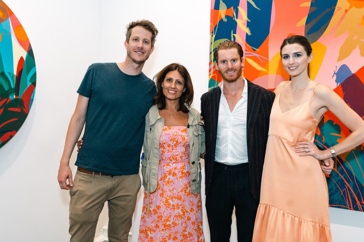 People inside Carousel Fine Art's Miami gallery space during Neill Wright's exhibition "Where the Light Gets In."