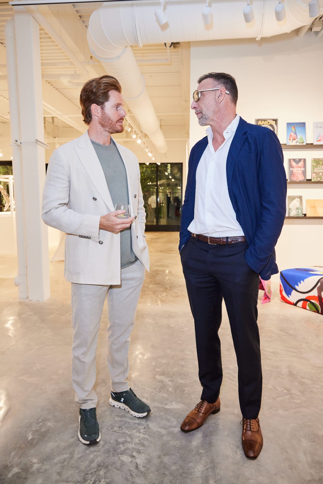 Gallery owner taking a photo with key collectors at the NORA District West Palm grand opening celebration.