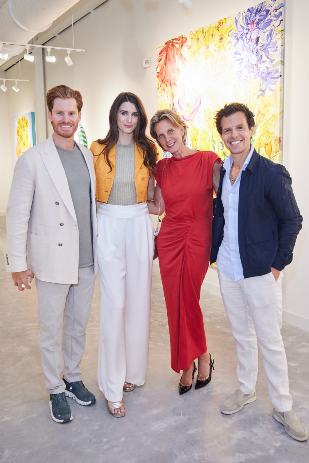 Gallery owners posing with VIP clients while at the grand opening of Nora District's best contemporary art gallery.