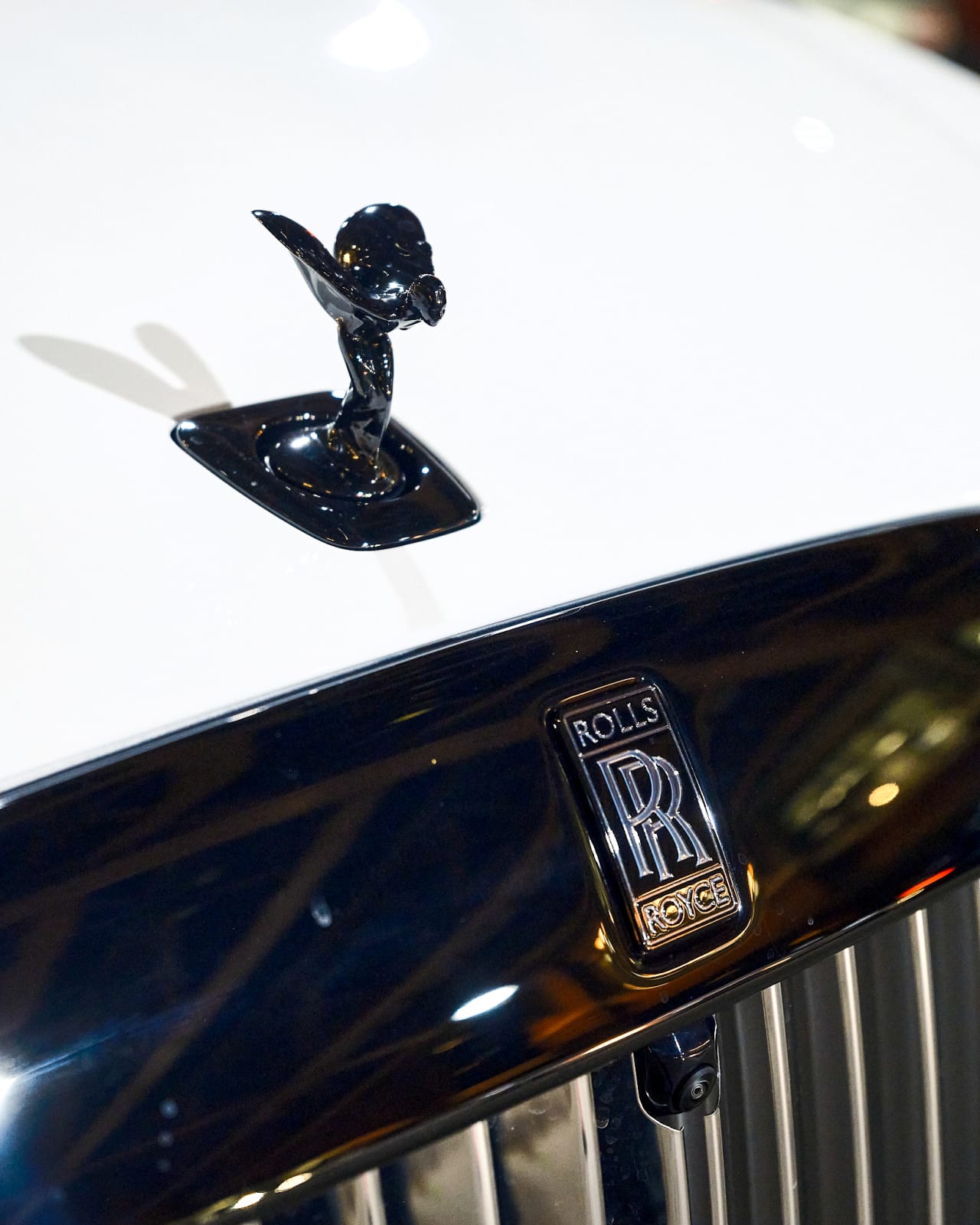 Close-up of Rolls-Royce Spirit of Ecstasy hood ornament shining outside Jason M. Peterson event in River North Chicago.
