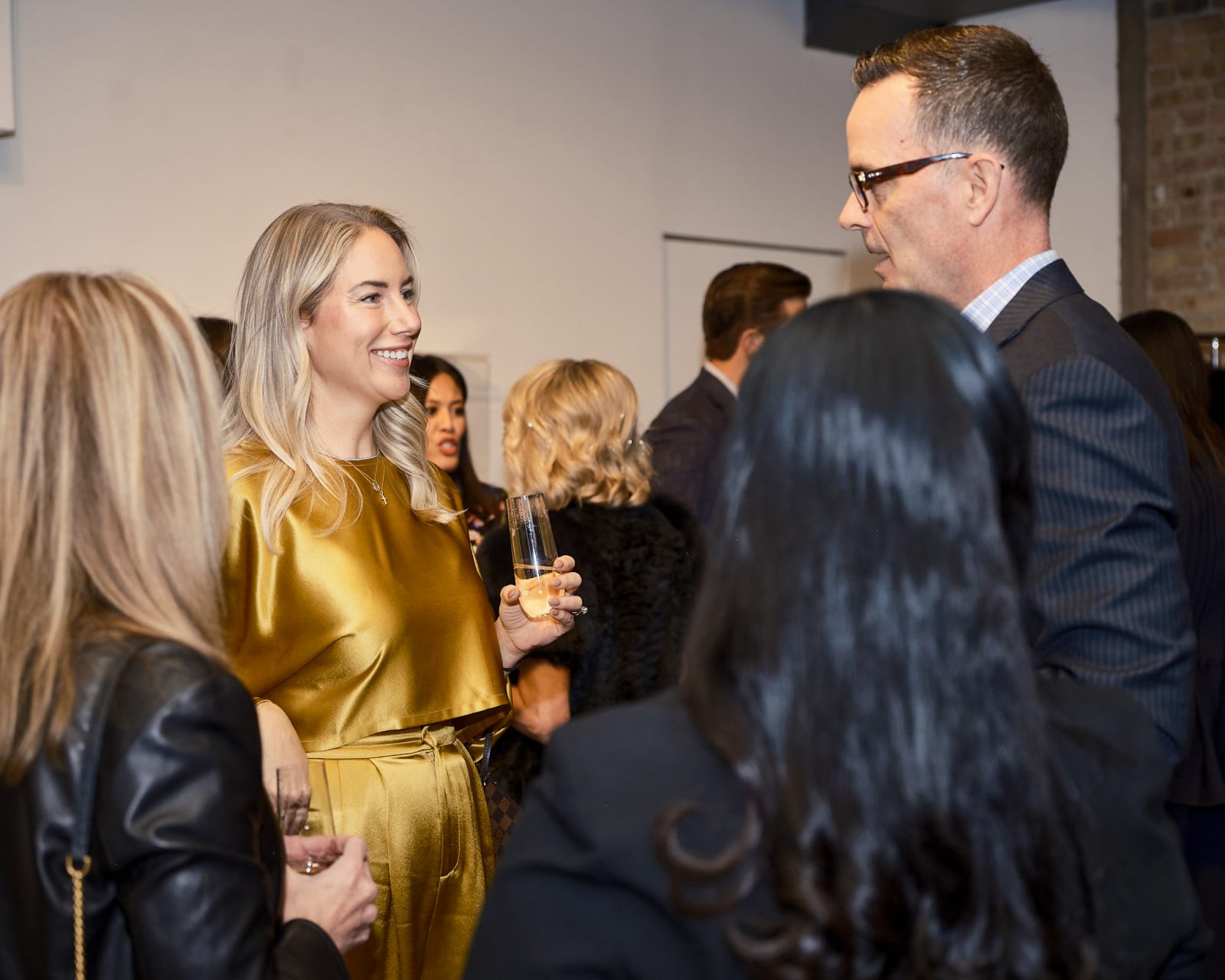 High-end crowd entering River North art gallery for Jason M. Peterson and Rolls-Royce luxury event.