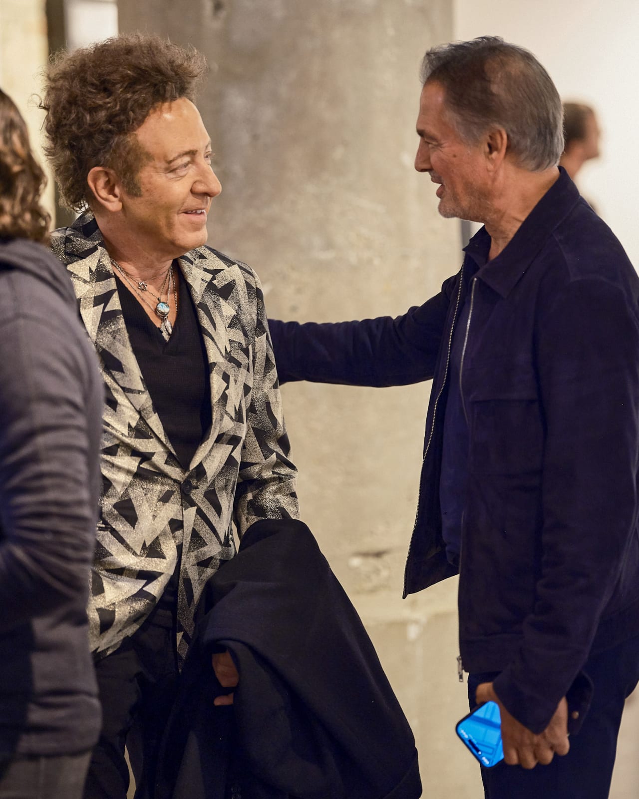 Networking moment between luxury real estate agents at Jason M. Peterson Chicago exhibition.