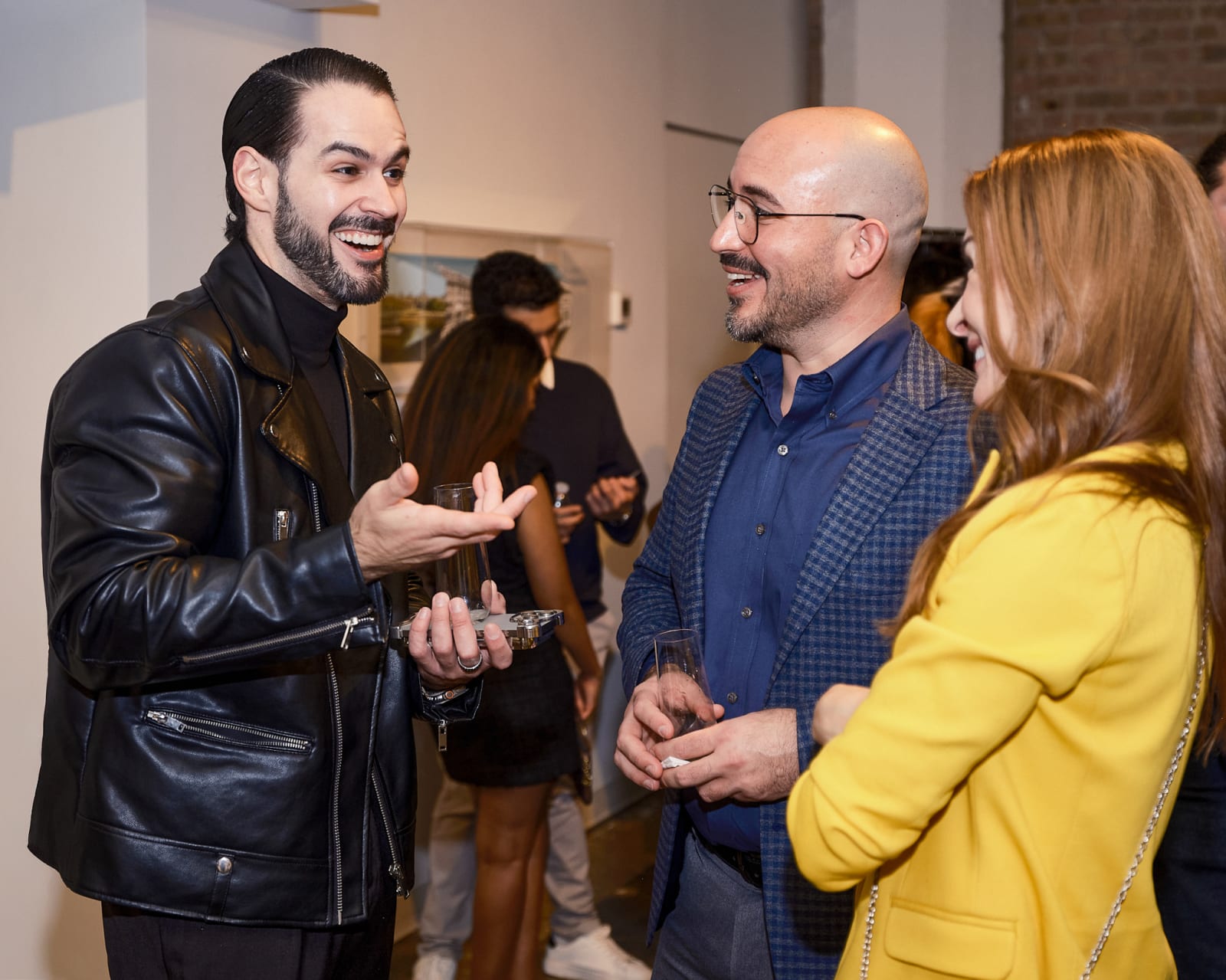 Crowd shot of collectors and agents inside River North gallery at Jason M. Peterson spotlight show.