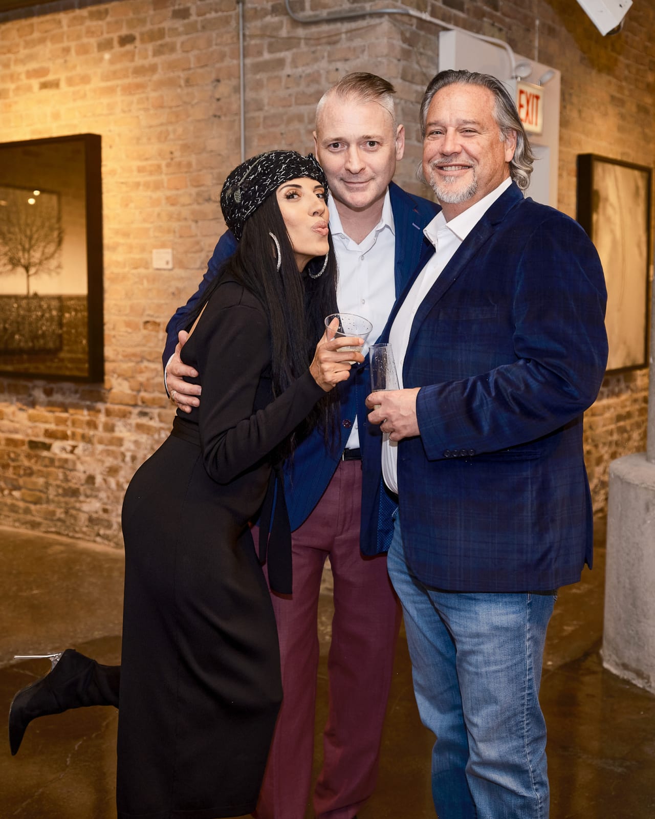 Advisor leaning in to explain details while client smiles for candid photo at Jason M. Peterson spotlight event.