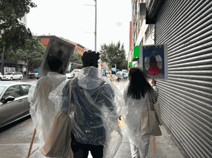 Participants carried signs with illustrations made by artists from around the world.