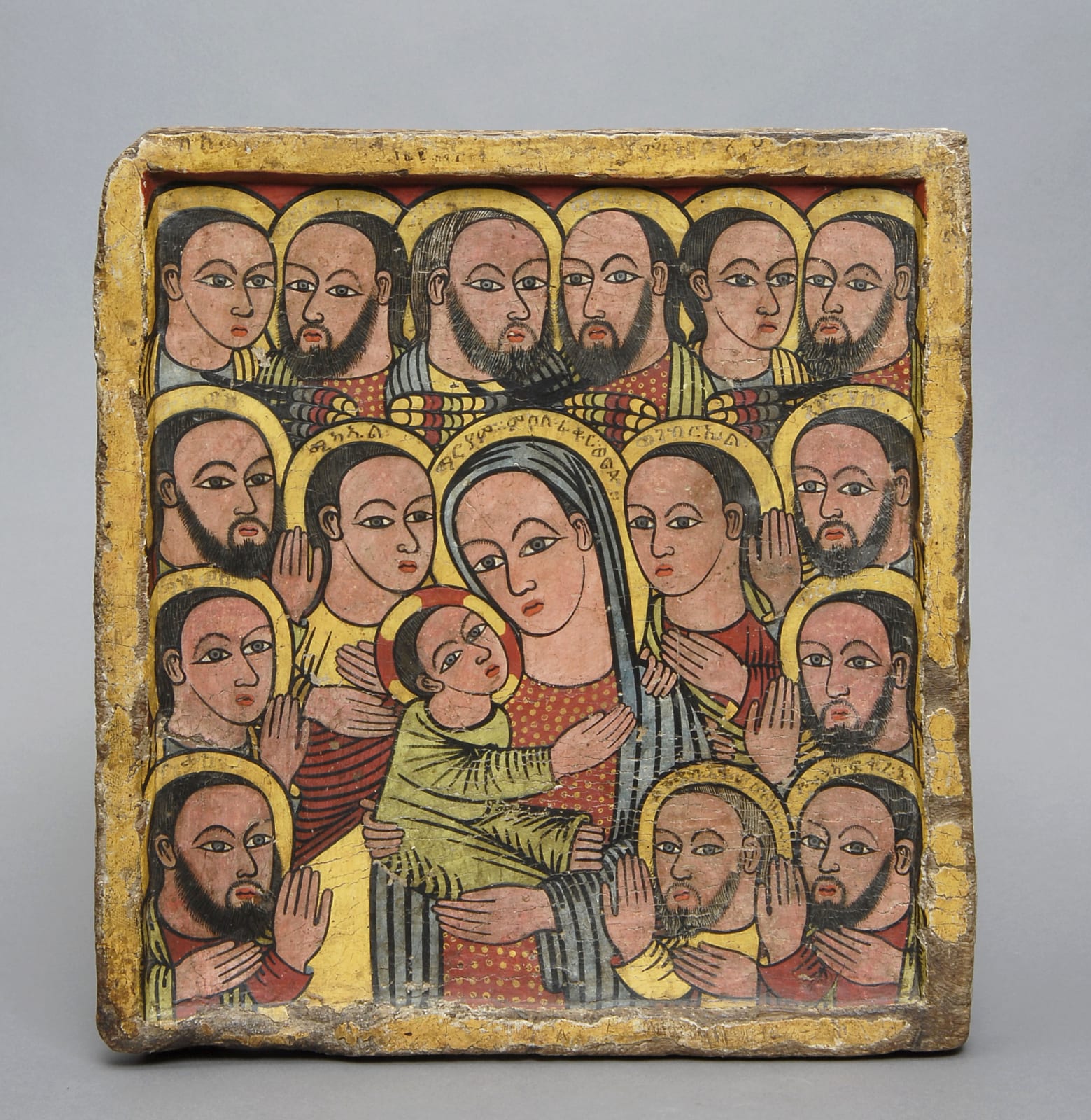 Icon of the Virgin holding the Christ Child with the archangels Michael and Gabriel, and 13 apostles, Ethiopia, mid to late 15th century