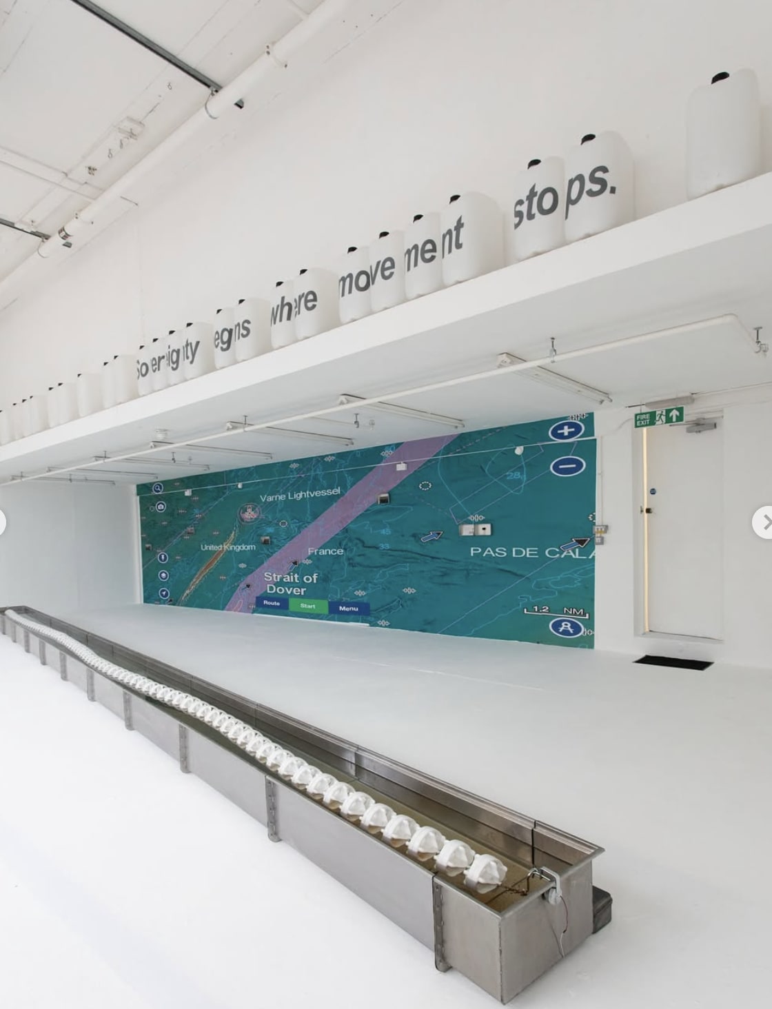 A Drawn Line, 2025 A section of maritime border (English Channel seawater, swimming pool lane divider, stainless steel tank), jerry can, postcard, spit, tin box, wall print, vibration resonance speaker