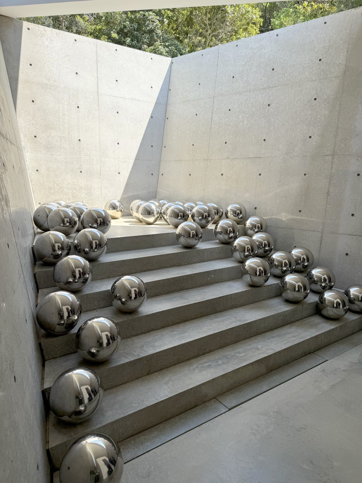 Indoor view of Yayoi Kusama's "Narcissus Garden", architecture by Tadao Ando. © OSME Fine Art 2025