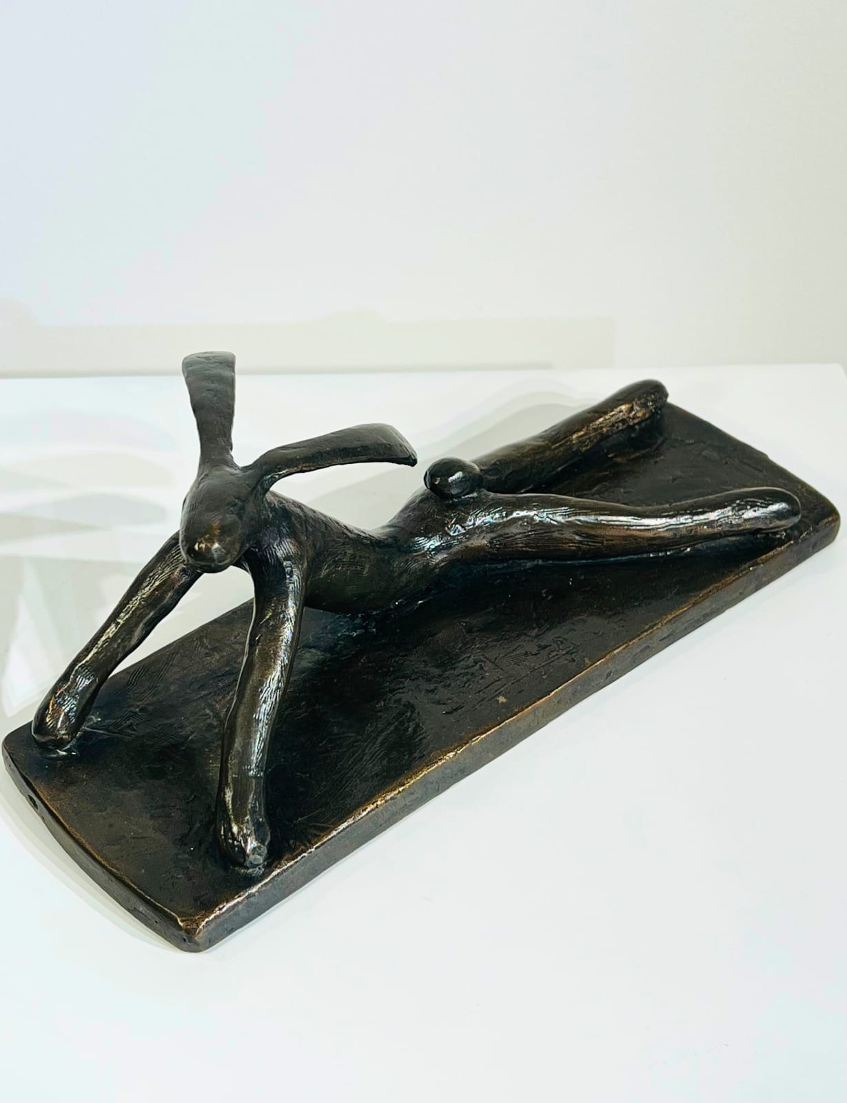 Hare Stretching on the Floor bronze sculpture by Guy du Toit
