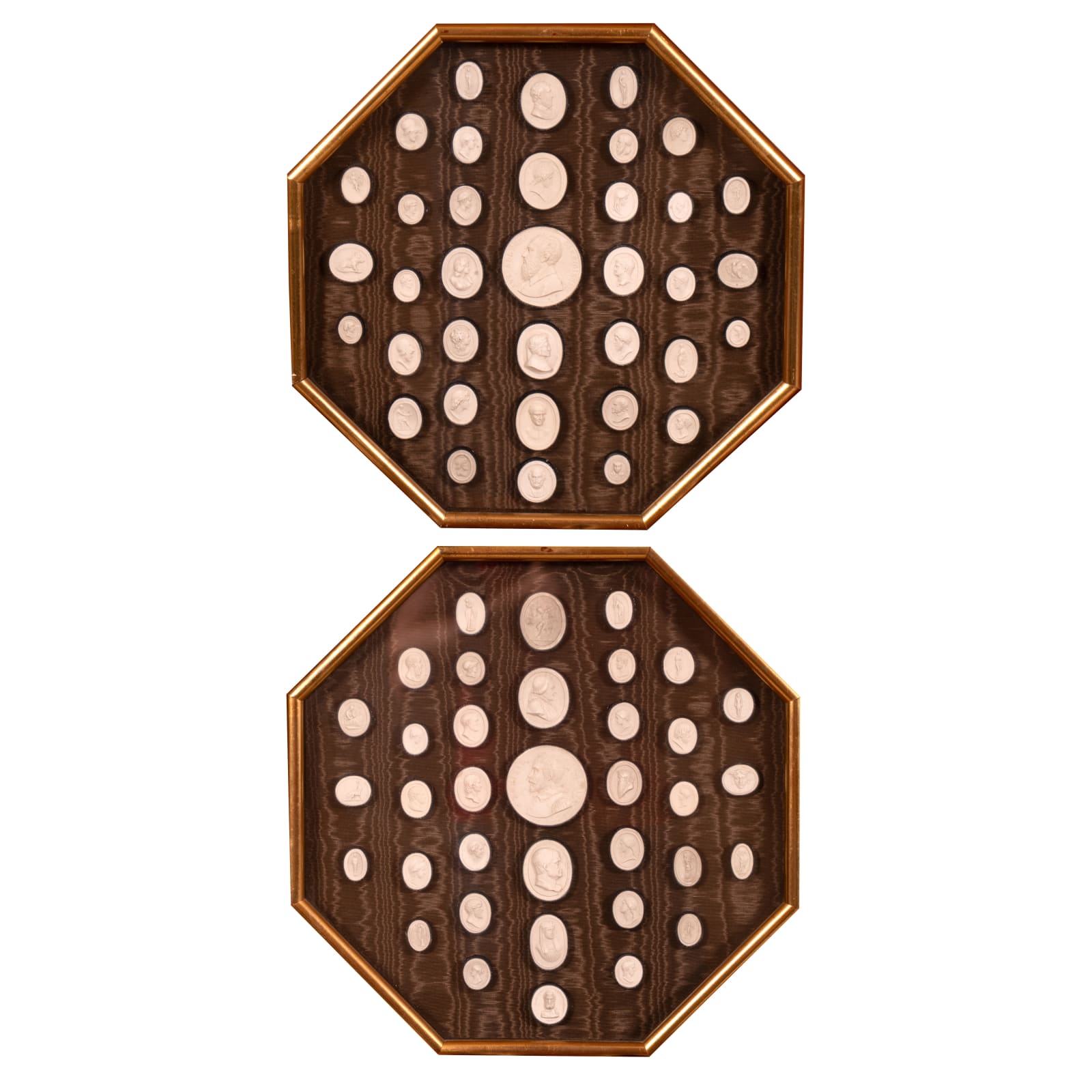 A pair of framed Italian plaster cameos