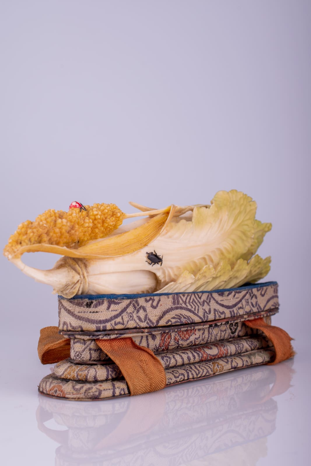 A Chinese carved canton ivory polychromed fruiting pod, naturally modelled and overlaid with insects, early 20th century