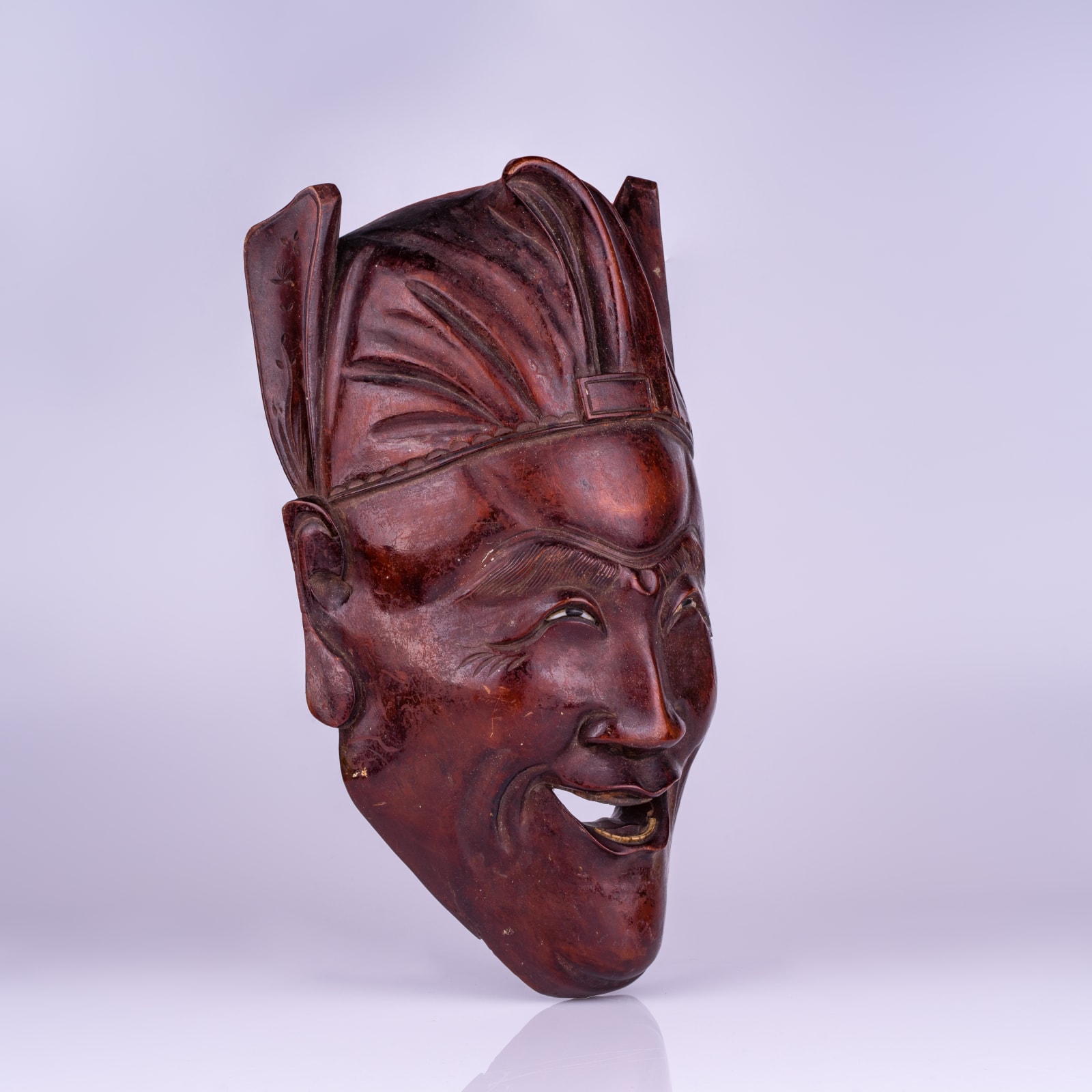 A Japanese carved hardwood theatre mask, early 20th century