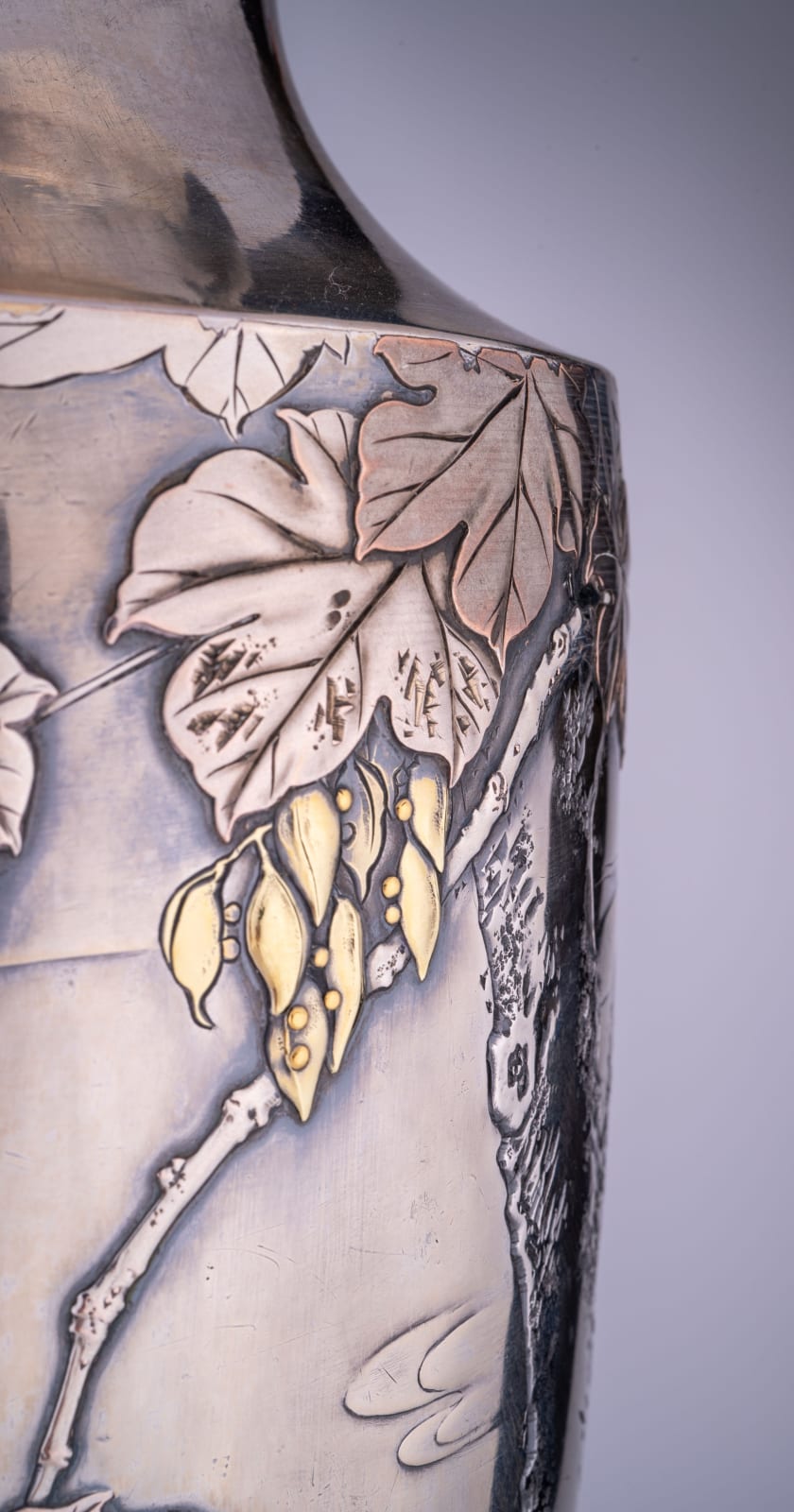 Kagawa Katsuhiro, A Japanese silver vase with gilt accents, Meiji
