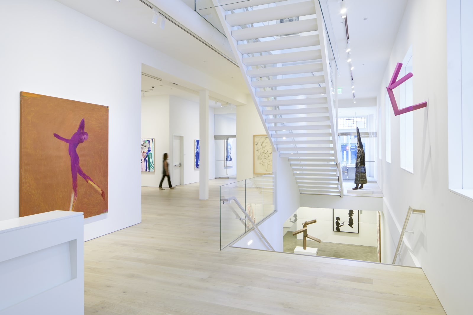 Ground floor facing north, featuring the center staircases to the second floor and lower level of the gallery. Installation view of The Human Form, January 13-March 11, 2017.