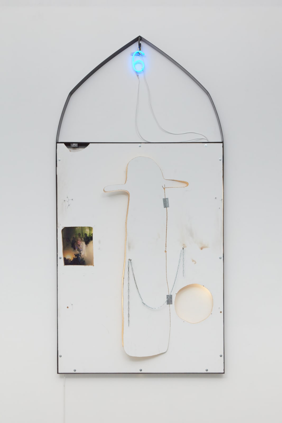 if 9 turned into 6 (i don’t mind) le fou du trou (door for a hat head) ,2021 Wood, white paint, neon, tube light, steel, duratrans photograpic film, chain 250 x 124 x 10 cm