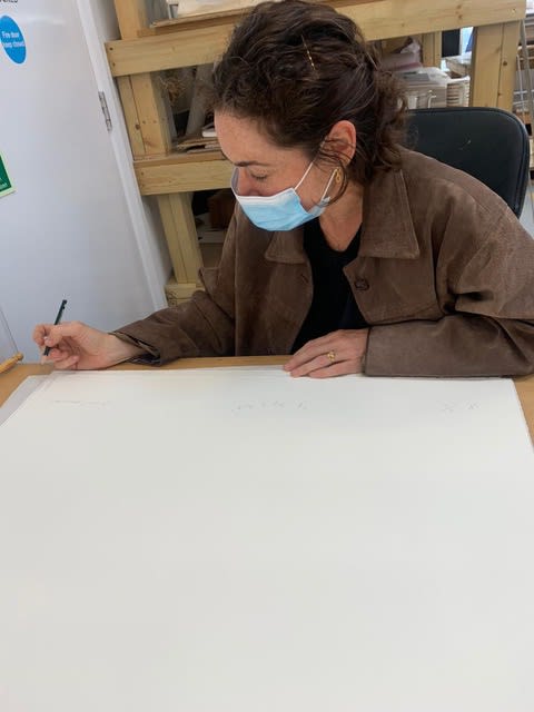Rosalind Nashashibi signing and numbering the editions of A Drop of Scent, 2021