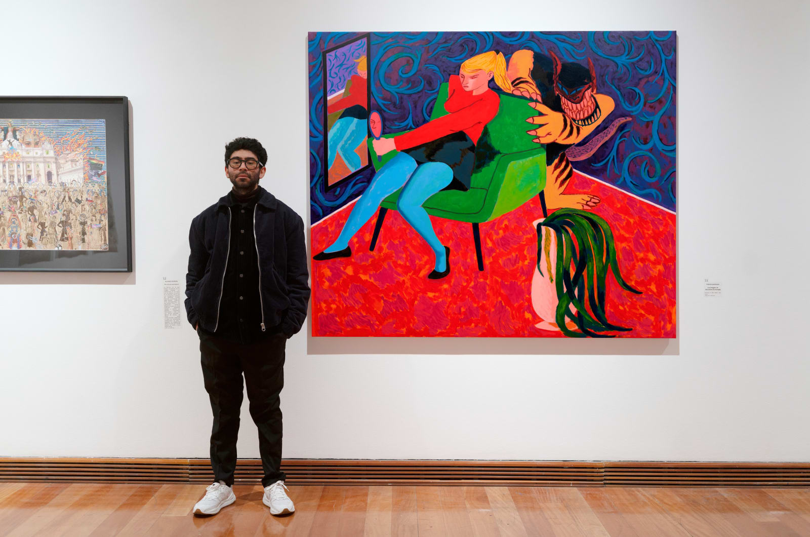 Rolankay with his artwork La Imagen Te Devuelve la Mirada at the Museum of Visual Arts in Santiago.