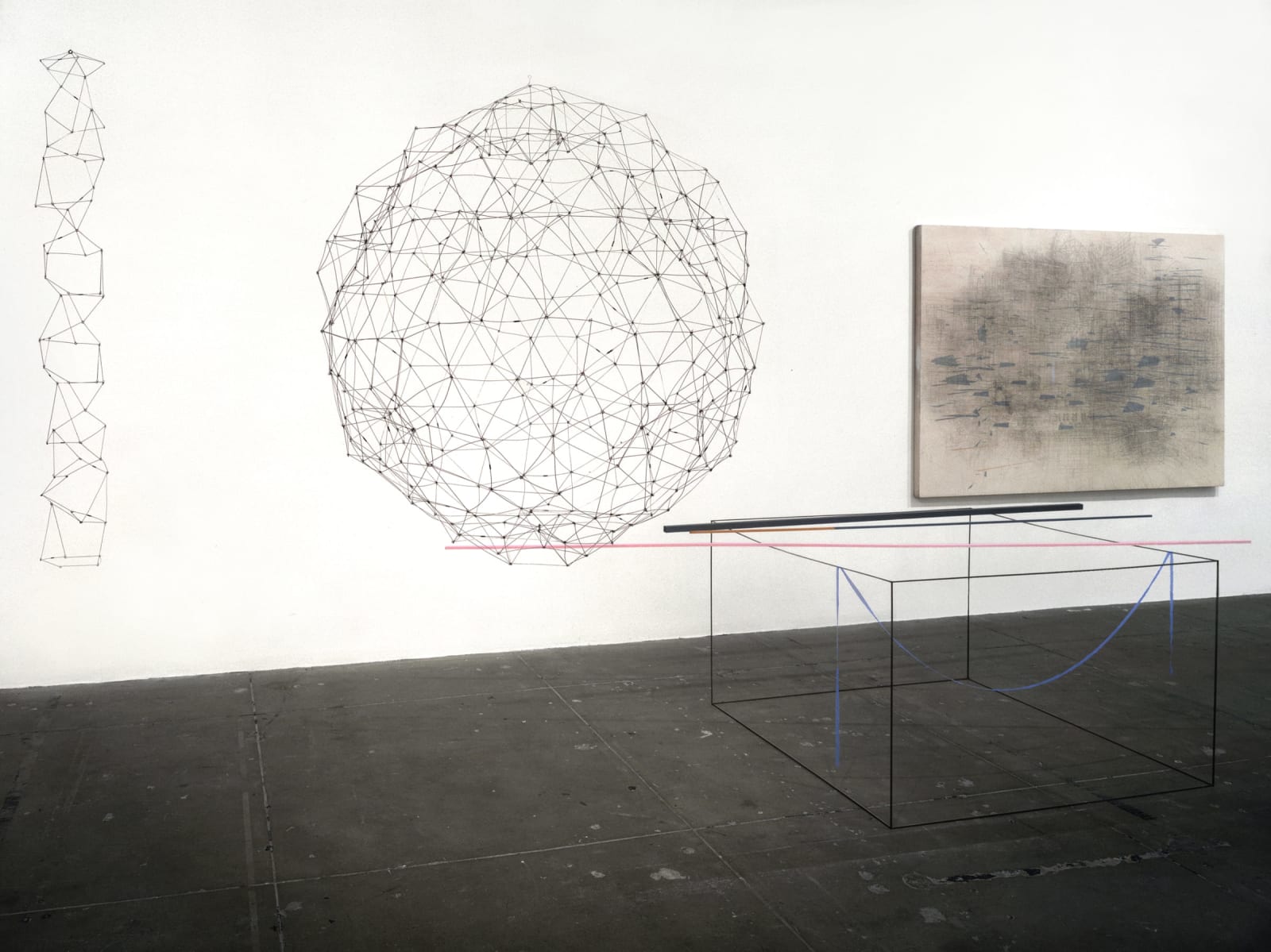 Three wire sculptures and one abstract painting in a gallery room.