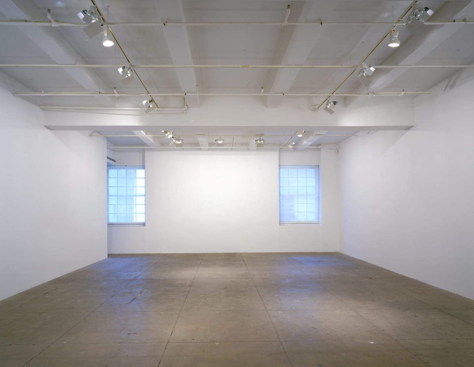 An interior view of the gallery space with 2 windows at Marian Goodman Gallery, New York