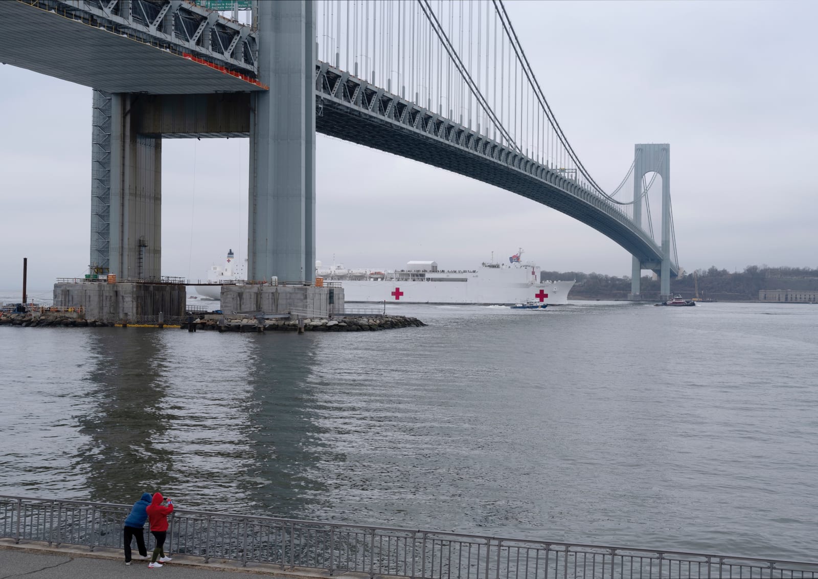 An An-My Lê photograph: U.S.N.S. Comfort under the Verrazano Bridge, Brooklyn, New York, March 30, 2020