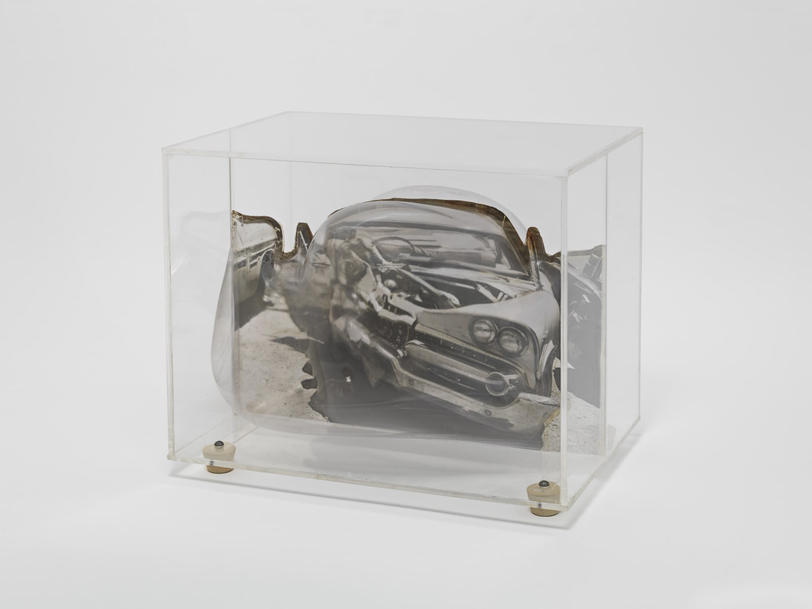 Carl Cheng, Car Wreck Sculpture - Black (1968). Film, molded plastic, plexiglass, 7 5/8 x 91/4 x 6 inches. Courtesy...