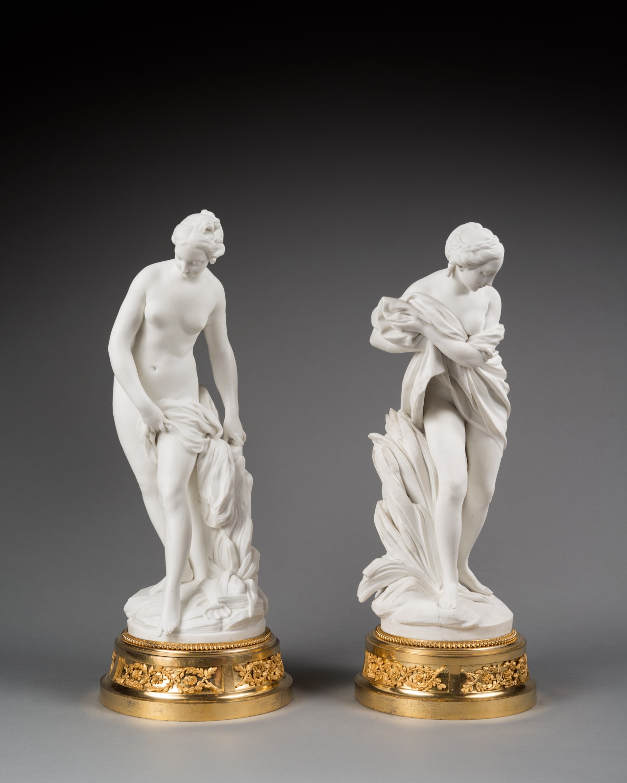 Sèvres, A pair of Louis XVI figures depicting 'Baigneuse' and 'Baigneuse aux Roseau', Paris, date circa 1758-1766