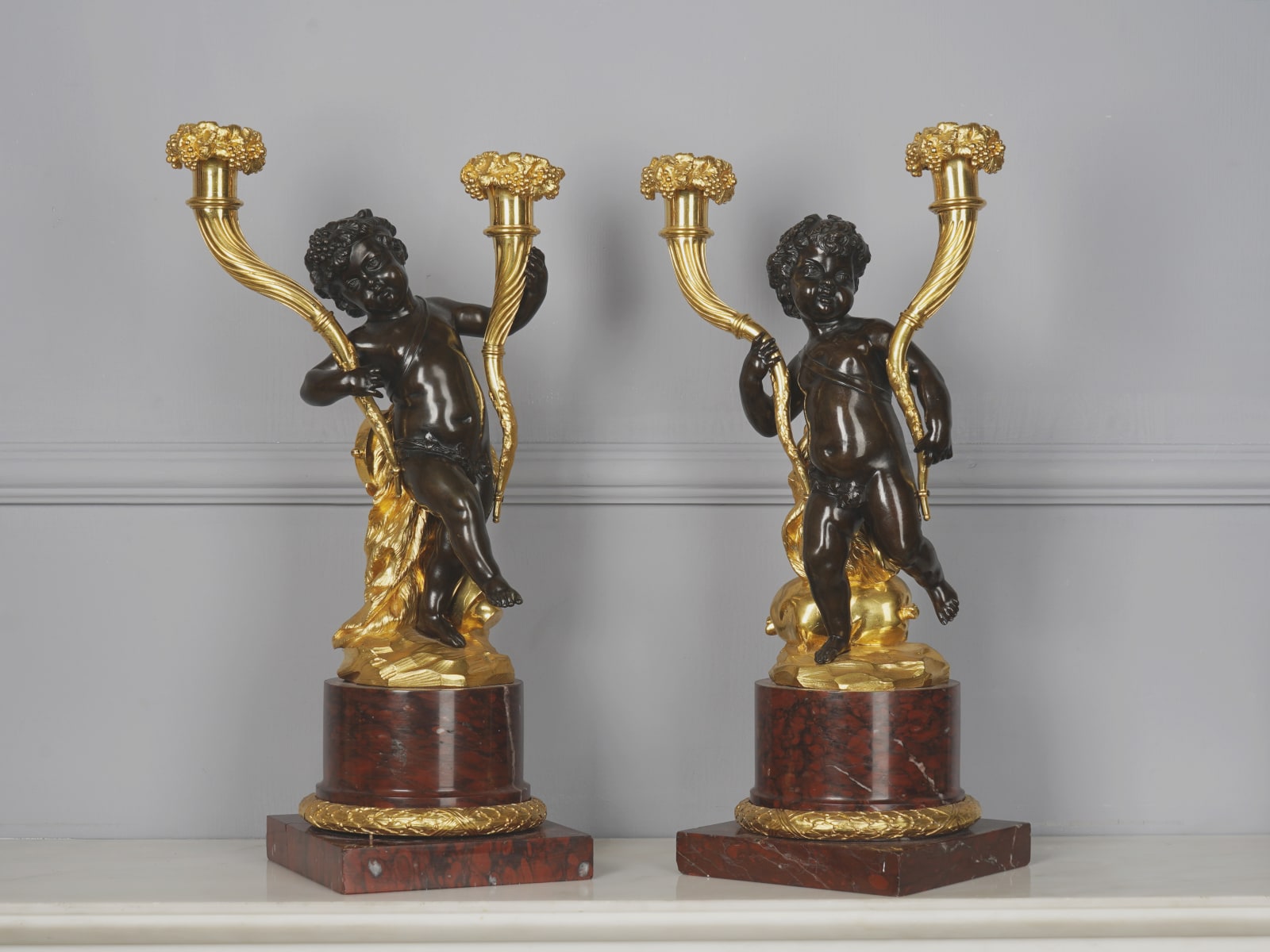 Louis-Félix de Larue, A pair of Louis XVI figural candlesticks attributed to Louis-Félix de Larue (after Clodion), Paris, date circa 1780