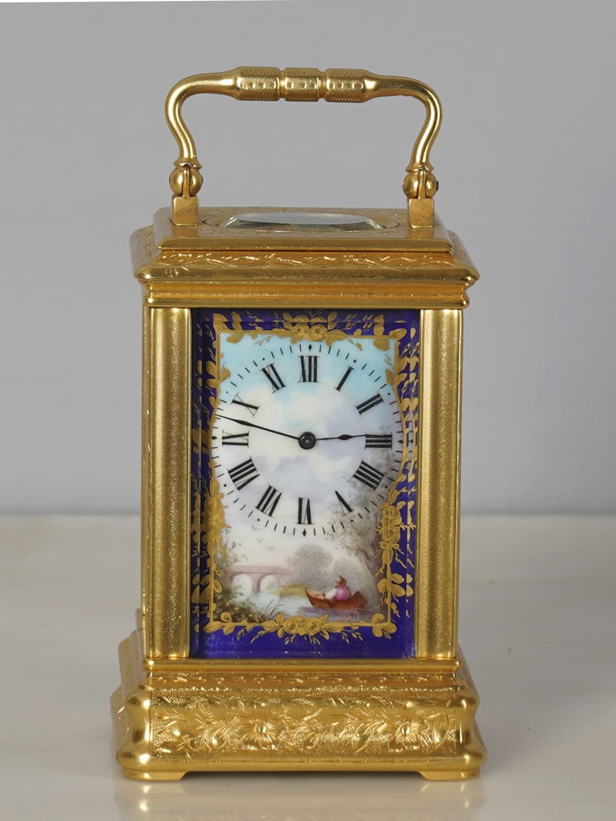 Unknown, A French miniature carriage clock with 4 porcelain panels ...