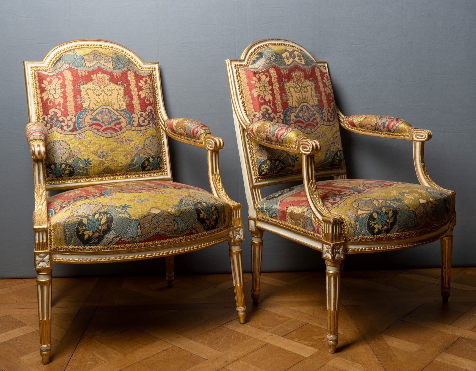 Noël-Toussaint Porrot, A pair of Louis XVI painted and gilt wood fauteuils, Paris, circa 1780
